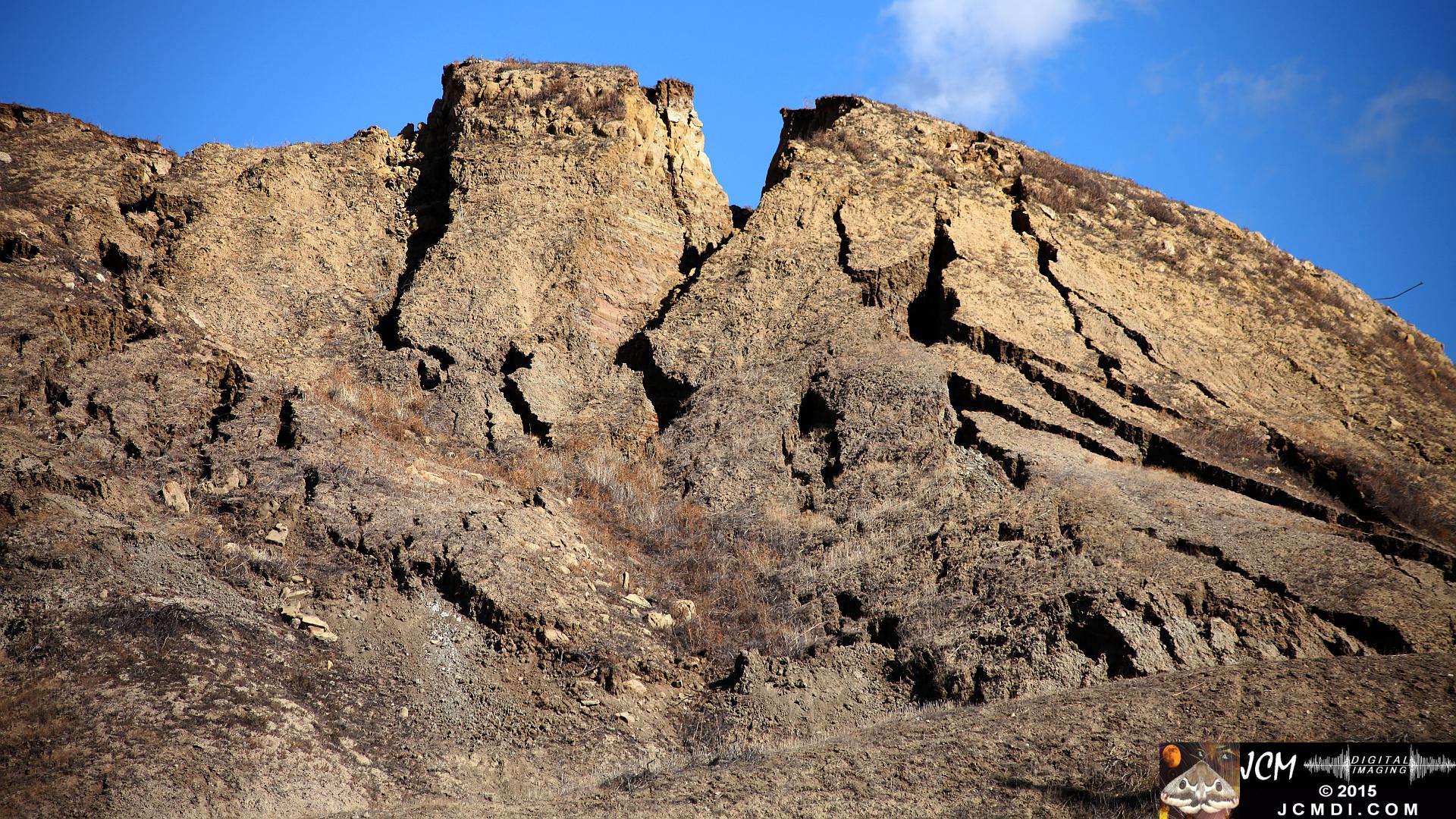 Landslide, buckled pavement, and terrain at Vasquez Canyon Road in Santa Clarita, CA filmed 11-25-2015